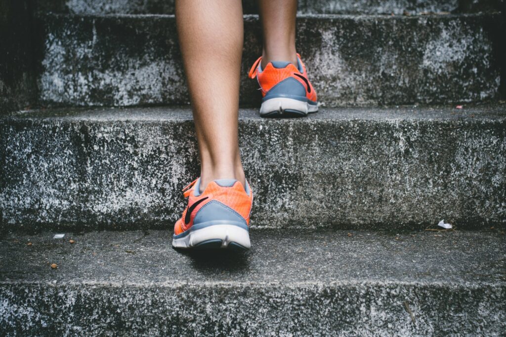 walking on gray concrete stairs